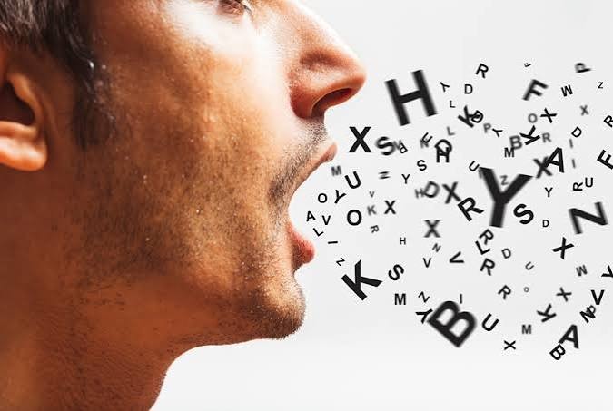 A man speaking, with letters flowing from his mouth, representing the power of the spoken word